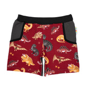 Bunt gemusterte Freshshorts für Kinder mit einfarbige Rückseite und Seitentaschen am Kind mit einfarbigem T-Shirt